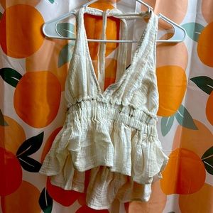 Open back top. Slight rip, easily fixed. Tie neck. NEVER WORN